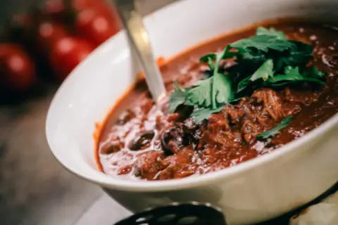 Bowl of rich lamb stew with herbs